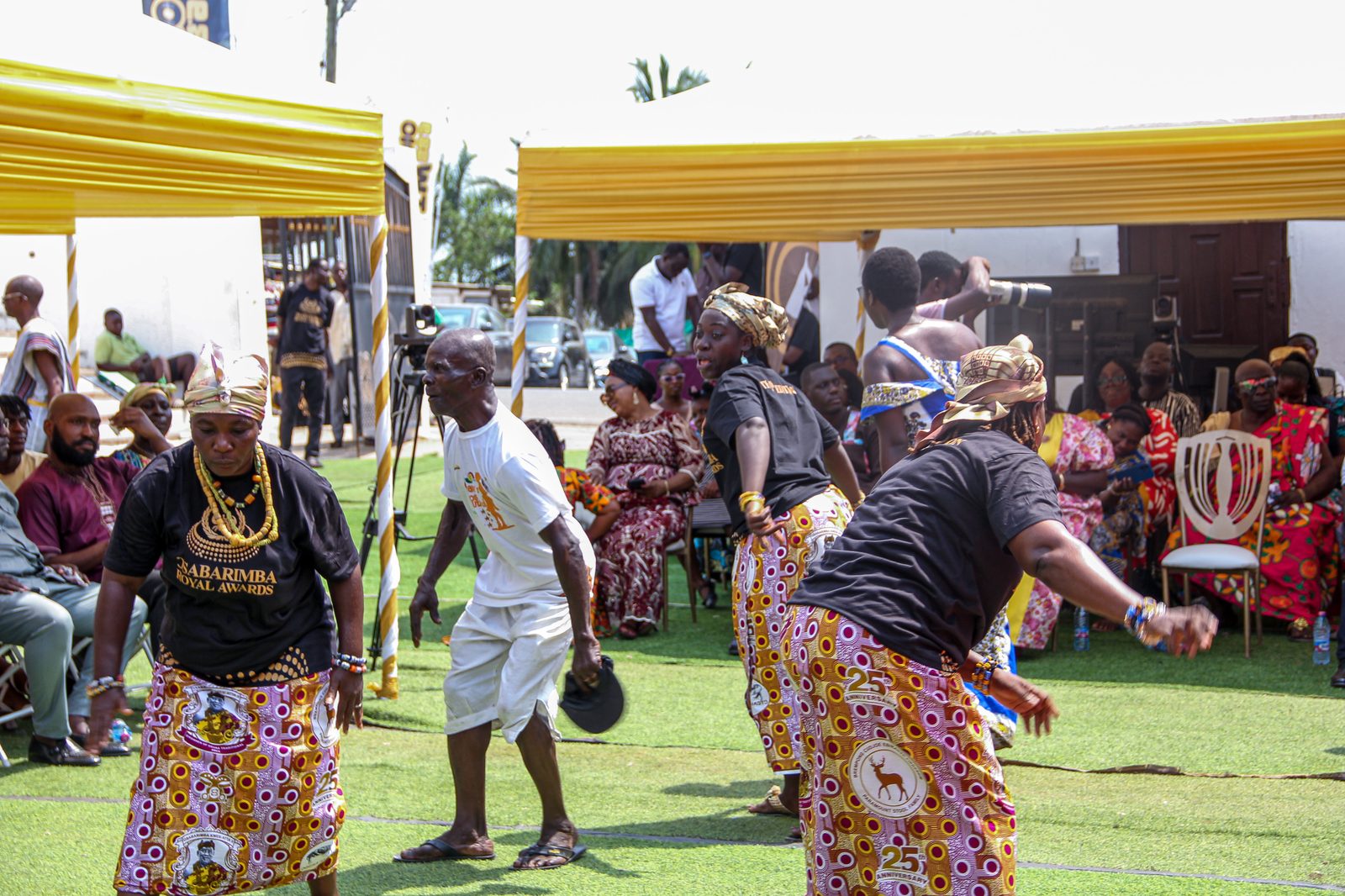 Cultural dancers perform under the gold canopies at the durbar