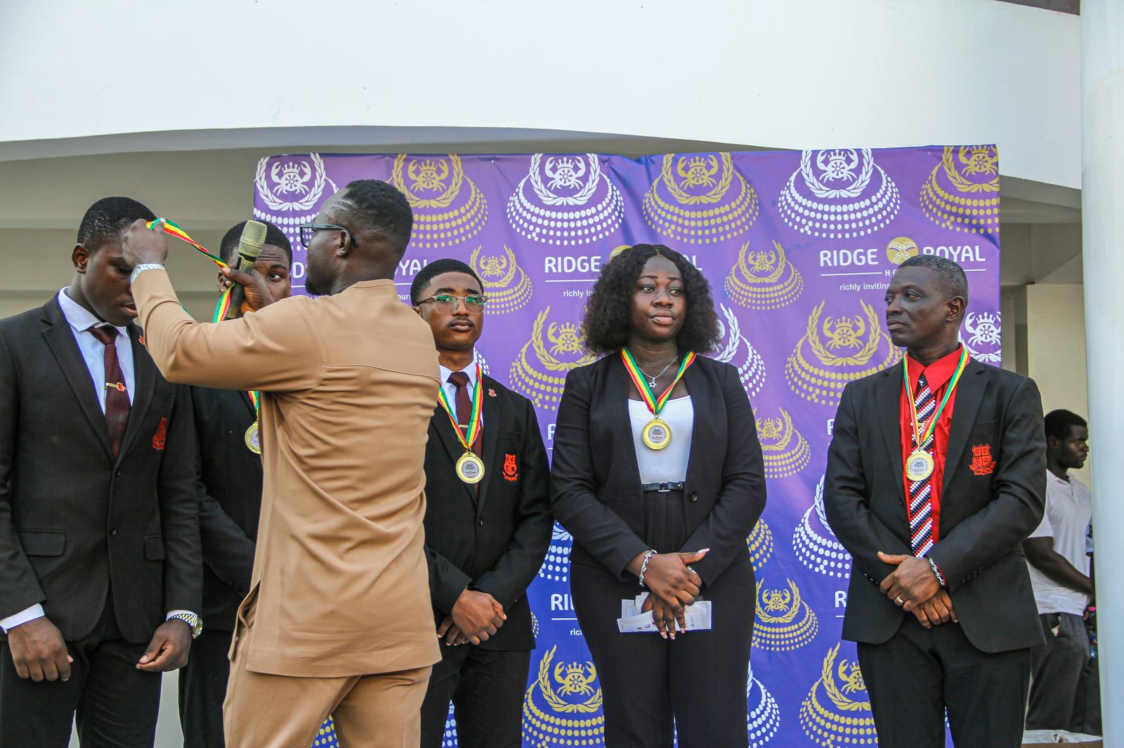 Honourees wear their medals at the 5th Edition, 2025