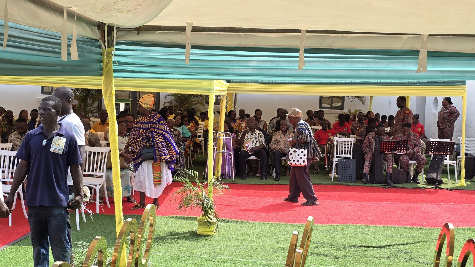 A cross-section of award winners and their guests under the canopies