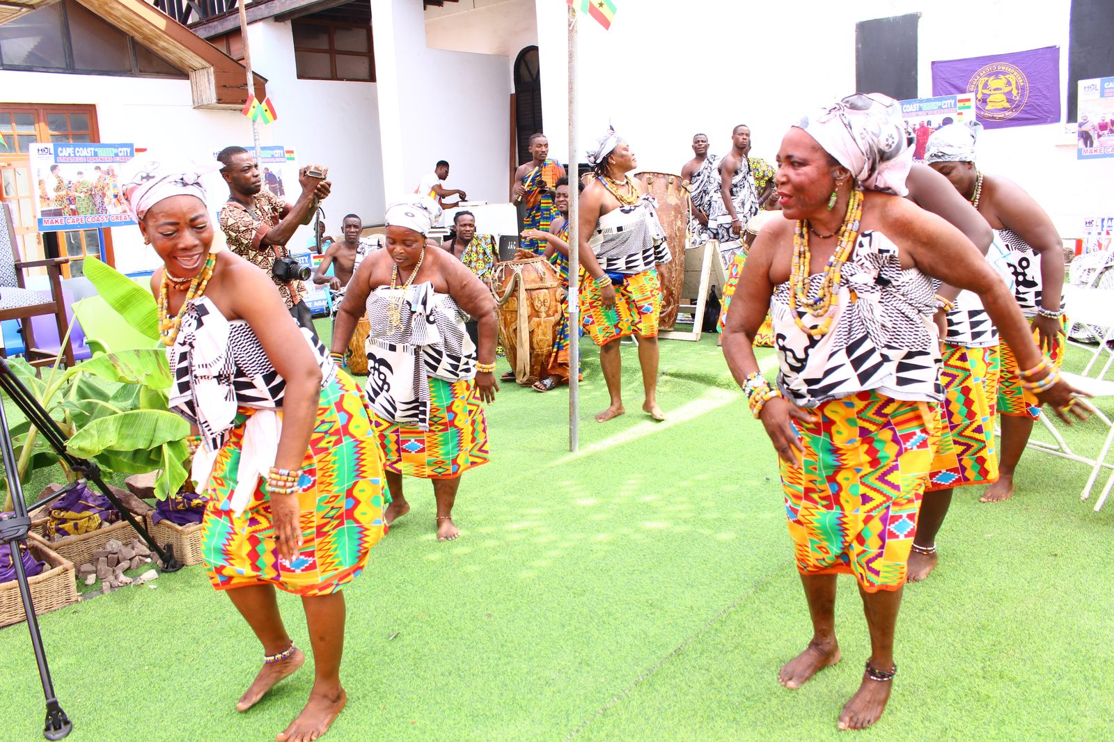 Traditional dancers perform in kente at the palace grounds